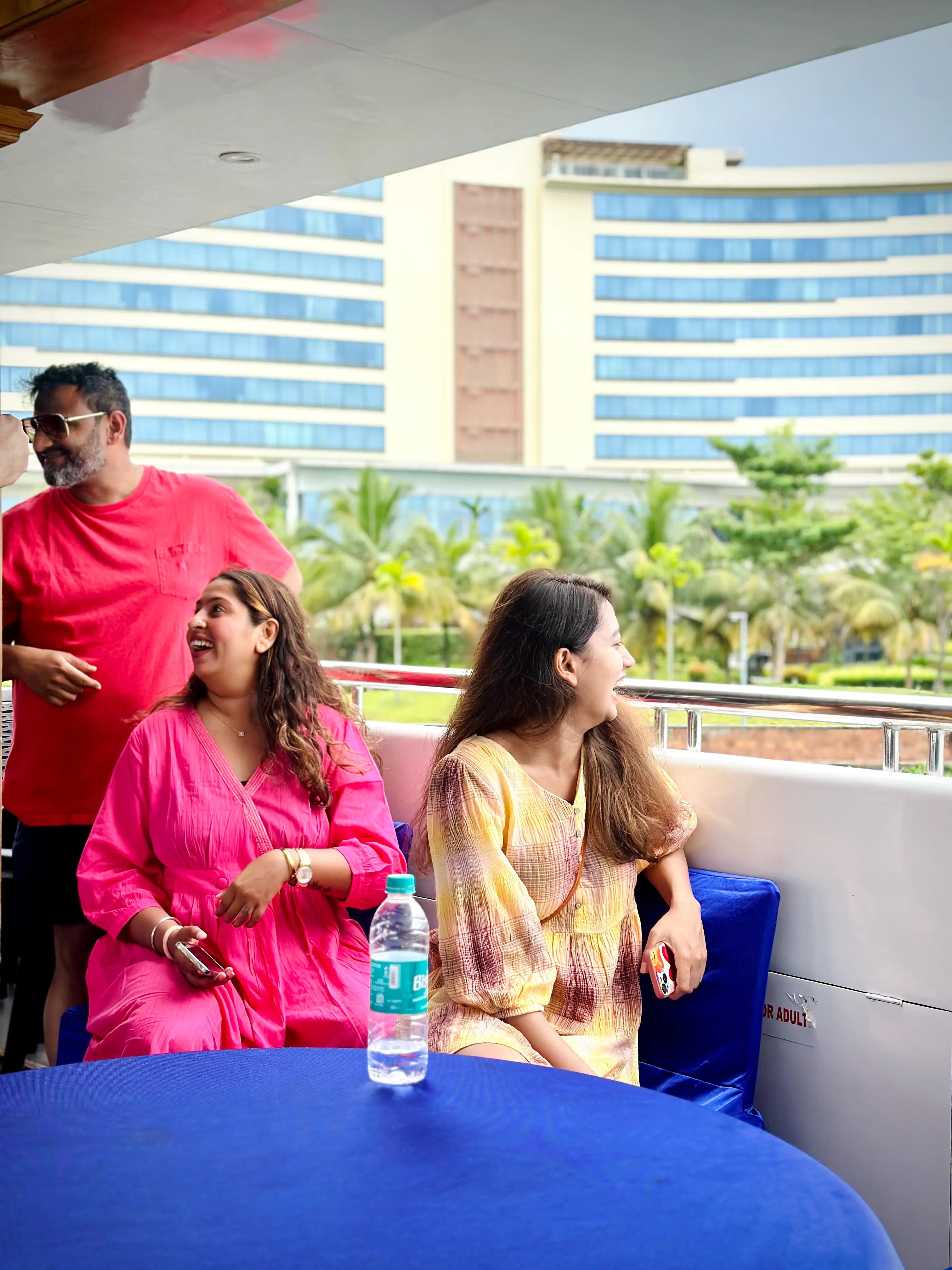 Minar Cruise passengers enjoying luxurious catamaran experience in Kochi, with scenic city views and comfortable seating for family gatherings and celebrations