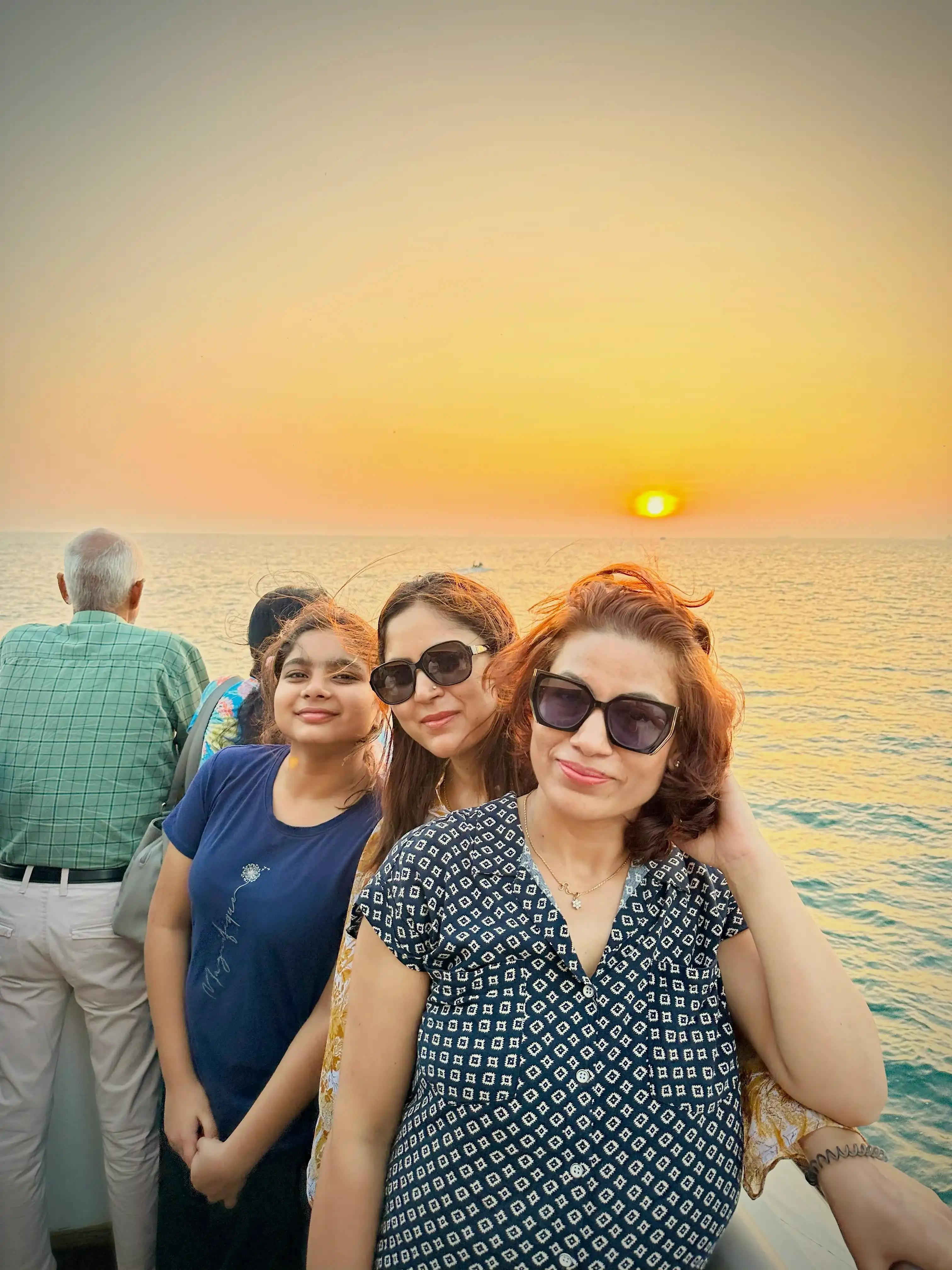 Sunset cruise in Kochi Family enjoying breathtaking Arabian Sea views on Minar Cruise's luxury catamaran, perfect for memorable celebrations and gatherings