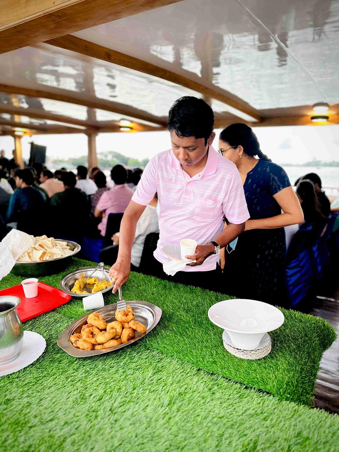 Guests savoring delicious cuisine while cruising the Arabian Sea on Minar Cruise