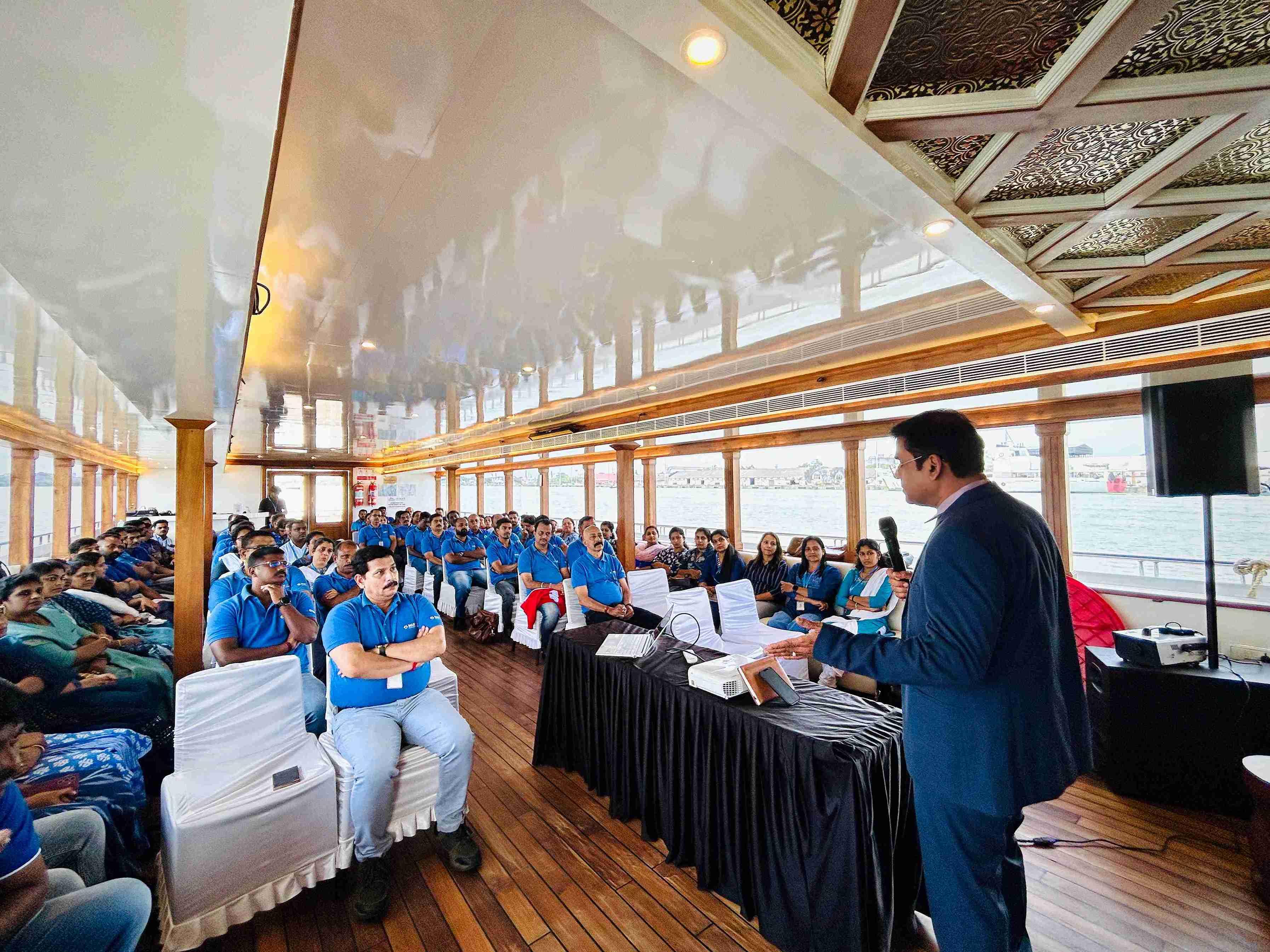 Business partners holding a conference on the all-suite Minar Cruise with scenic views