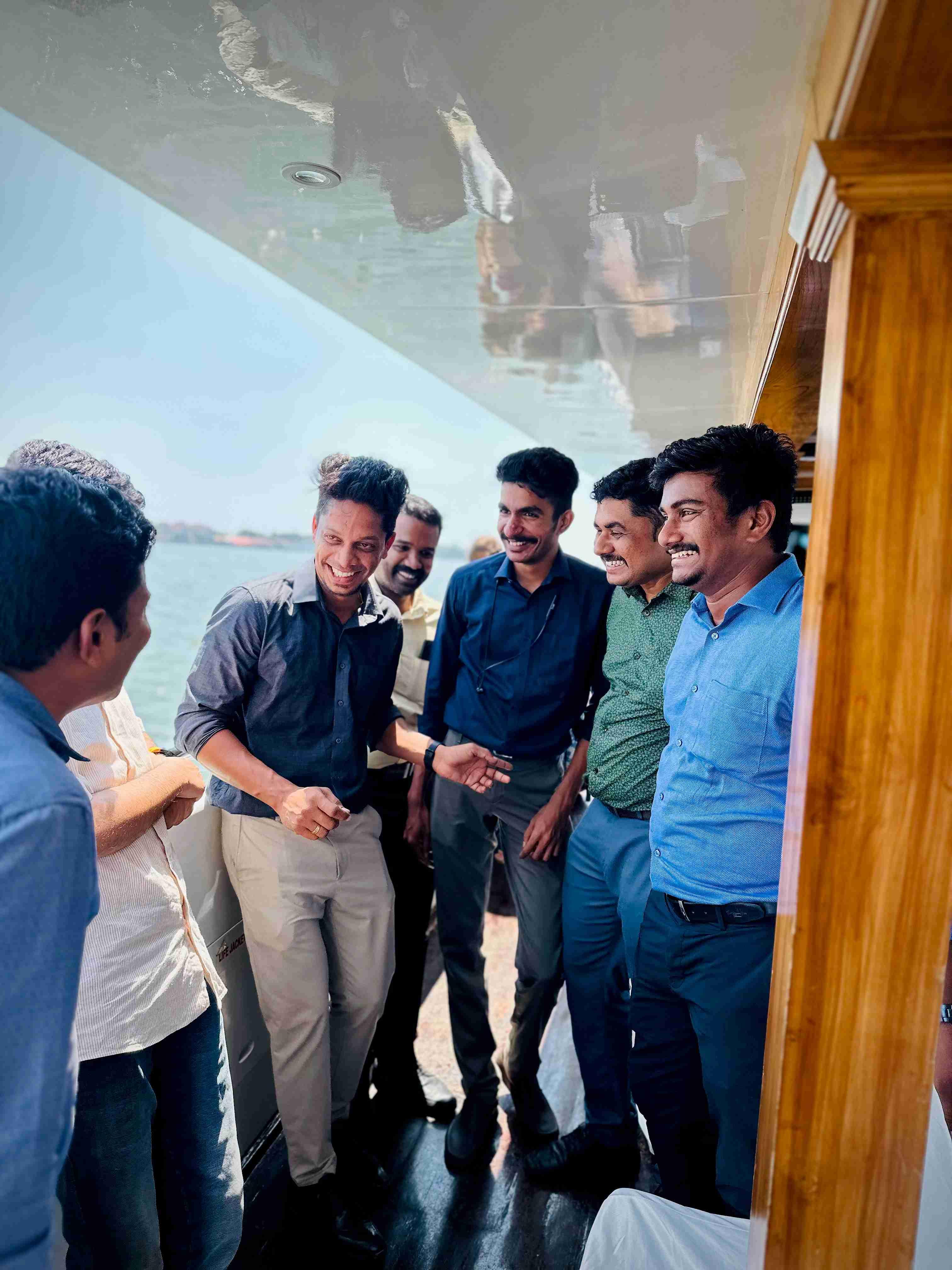 Business professionals networking on Minar Cruise, Kerala's premier catamaran for corporate events and scenic Kochi sea tours